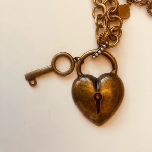 Vintage necklace in tones of brass. Heart and key medallion chain with 12” drop